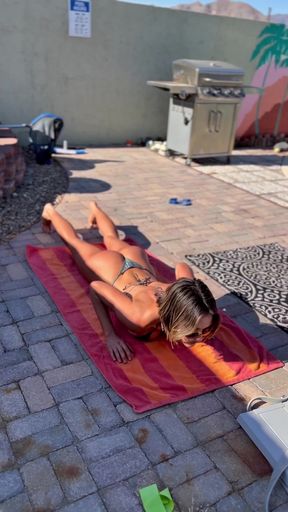 Sunbathing in the backyard