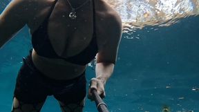 Bounty Hunter Carissa enjoys some underwater time and breast exposure in the spring