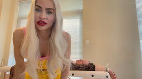 Harley Quinn makes use of her captured girl.