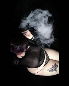 Curvy goth vaping in sheer outfit