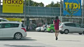 Crossdresser wears red mini dress in public