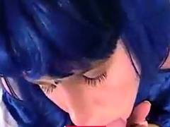 Blue wig crossdresser blowing