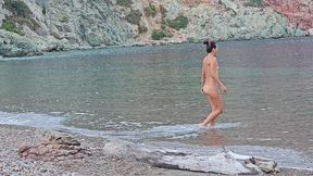 nudist woman piss on a wooden log#public beach