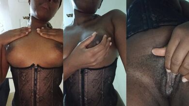 Ebony goddess teases her oily tits and hairy pussy in black lace corset