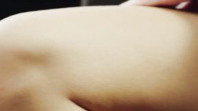 ”Her perfect body trembles as she fingerbangs her shaved twat”