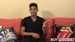 Black young man gives an interview and stimulates himself