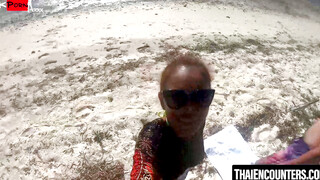 SunKissed Beauty Tempts the Sand with Her Scorching Body