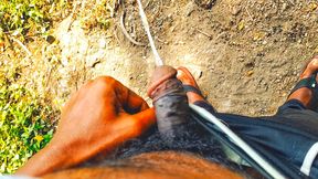 Hairy black indian cock pissing outdoor.