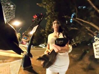 Kelly goes for a walk downtown in a constricted lewd costume