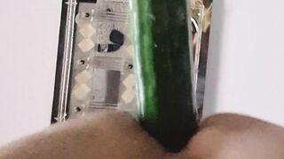 sugary-sweet she-male inserts a 25cm cucumber