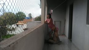 My wife teasing me on balcony