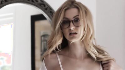 Blonde minx with glasses behaves very naughtily in the bedroom