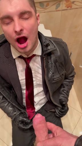 Office boy in suit takes a piss from his boss
