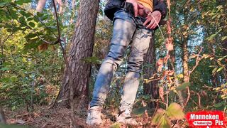 Fellow lengthy peeing in the woods under a tree