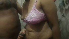 A husband and wife are having sex in the bathroom.