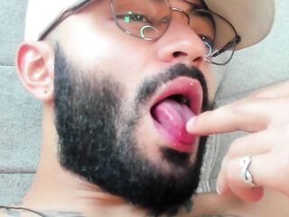 Moist lips and teasing fingers in a fleshly cam close-up