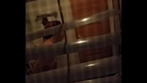 Asian girl undressing to shower