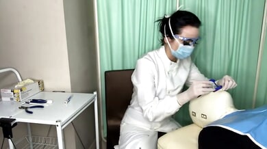 Dental patient restrained on exam table receives handjob from masked dentist