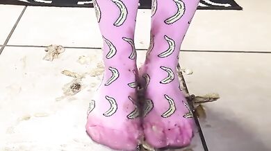 Big feet in socks squish and crush bananas while worshipping cum