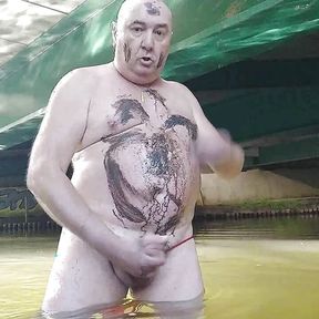 Fat pig Pascal masturbates in the humidity and mud under a bridge