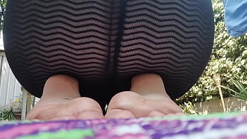 Sweet little feet in flip flops to be adored in a public park