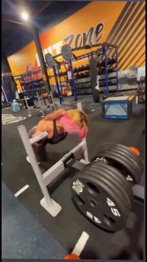 Busty wrestler Chiori shows off her huge tits and phat ass during workout