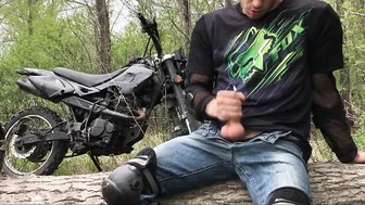 Muscular Russian biker jerks off big cock outdoors in the woods