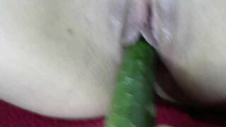 Comforting with a cucumber. lusty dark hair
