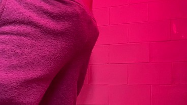 Guy pissing in the toilets of a bar