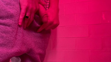 Guy pissing in the toilets of a bar