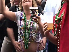 Admirable girls are flashing their sweet titties on the crowded street
