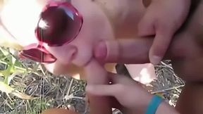 Slut eats 2 cocks at swinger beach