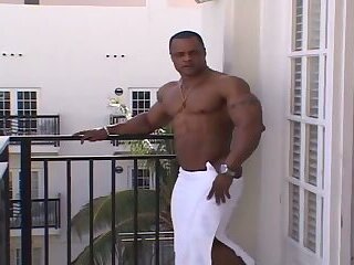 Silvio Samuel Flexing and Posing On A Balcony