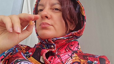 Smoking cigarette on a rainy day outside the bar