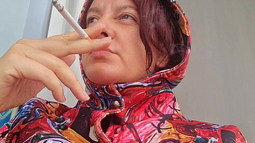 Smoking cigarette on a rainy day outside the bar