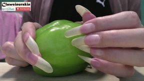 Nails cutting and destroying pepper