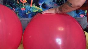 Girl in red dress poping red balloons