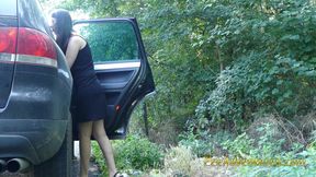 Changing her pee stained clothes outside