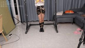 xy200-A Chinese girl wearing black stockings is tied up with ropes and stands with her neck fixed and her whole body tickled to stimulate her chest