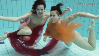 Two hotties submerged underwater