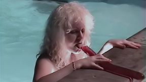 Wet hooker by the pool with a double dildo