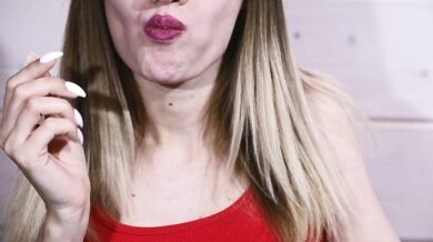 Blonde beauty fingers her glistening pussy while eating boiled eggs