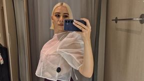 Trying on transparent clothes in the fitting room, Naked blonde flashed her boobs in a public place