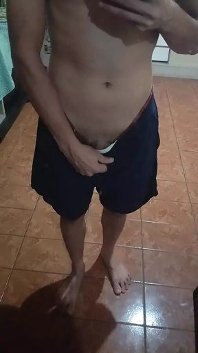 boy in shorts in the mirror