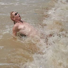 Swimming, splashing and posing naked in the sea...