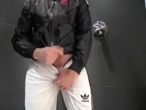 twink pissing in his Adidas tracksuit