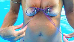 nippleringlover - horny milf does self nipple bondage in pool, pierced nipples bound with string pulled hard