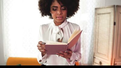 Black social sciences book worm studying with the help of professor's pink pointing rod