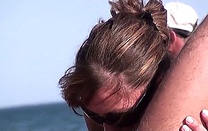 French nudist couple doing a hand- and bj in public on the beach