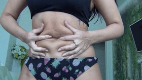 Tied up belly fat with black rope d